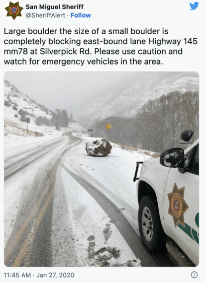 screencap of a tweet from jan 27, 2020 by the san miguel sheriff with a photo of a rock in the middle of a snowy road. Text reads "Large boulder the size of a small boulder is completely blocking east-bound lane Highway 145 mm78 at Silverpick Rd. Please use caution and watch for emergency vehicles in the area.