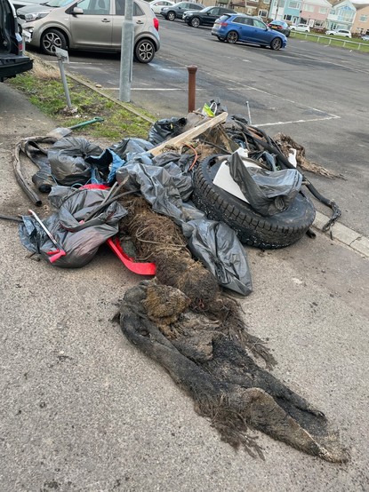 Sea Shepherd UK volunteers and public haul this rubbish off Newbiggin beach.