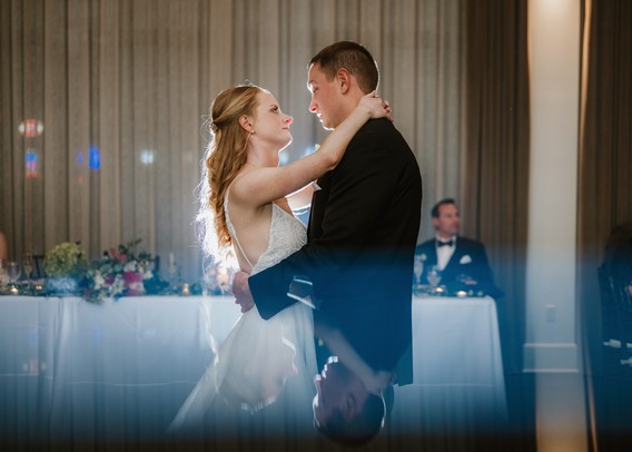 Bride and groom’s first dance at The George and Madcap Lounge (a Milwaukee event venue) on their wedding day. 