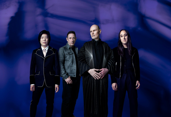 The Smashing Pumpkins have announced a new music festival called The World is a Vampire Festival. The festival will take place in Chicago this summer, and will feature guest performances from Jane's Addiction and professional wrestling shows. There will also be surprise guests and national acts, as well as performances from local bands. Tickets will be on sale soon