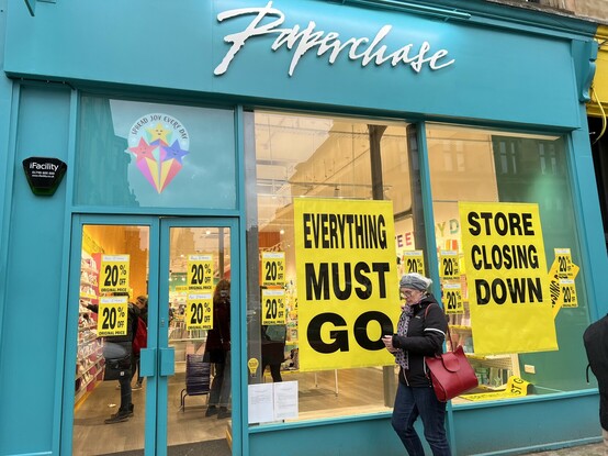 A Paperchase shop with a “closing soon” sign in the window.