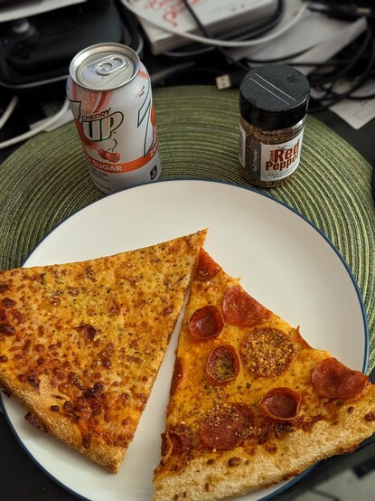 Two slices of "new york" style pizza from pizza hut
