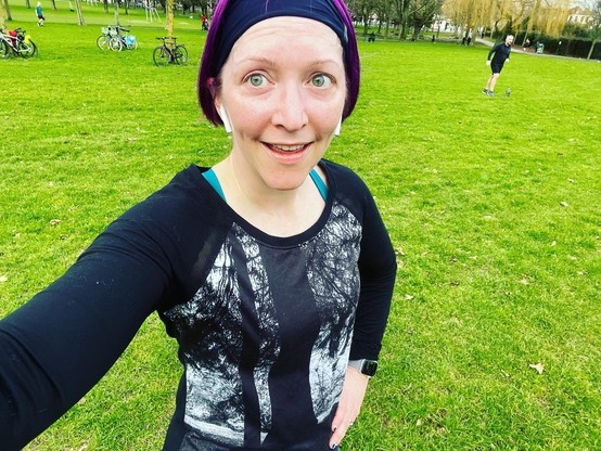 Pale white purple-haired lady in running gear post-run