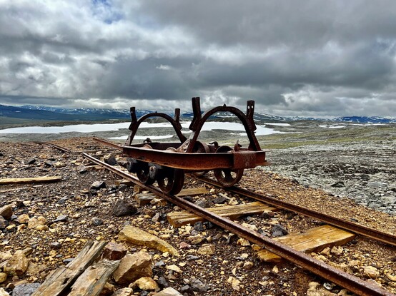 An old trolley of the mine, still on the rusty rails