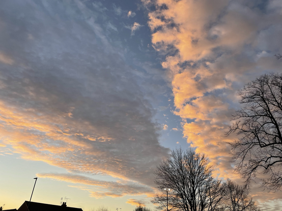 Clouds lit with a pinkish glow from underneath