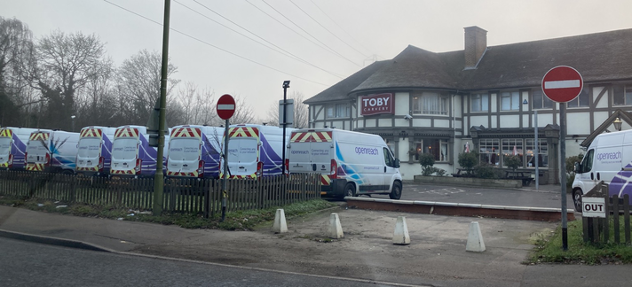 Selection of many BT Openreach vans in the car park of a Toby Carvery pub