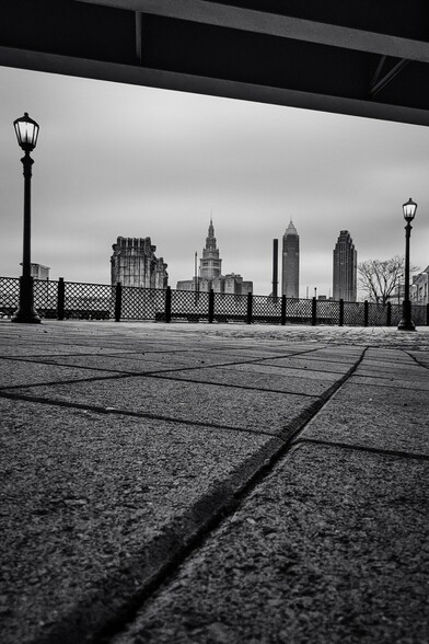 Black and white view of the Cleveland Skyline from the ground up.