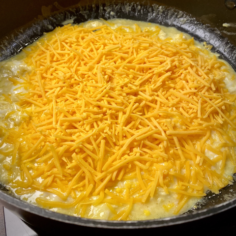 Added Cheddar cheese to eggs