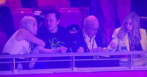 Musk and Murdoch at football game.