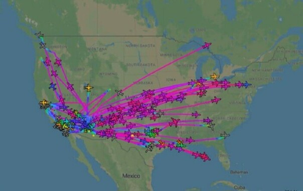 A map of the US showing the flight paths of hundreds of planes taking off from Arizona, to various parts of the US and Canada.