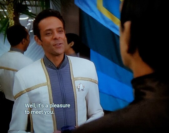 We're at a DS9 fancy party of some sort with lots of folks milling about and having drinks and hors d'oeuvres served amongst flowers and decorations. Everyone is dressed nicely, starfleet and non Starfleet. Picture one is Bashir, greeting someone. Closed caption reads, "Well, it's a pleasure to meet you."
Picture two is a tall Romulan looking fella. He's smug, stern, and generally unimpressed. Caption reads, "Why?"
Picture three is back on Bashir, caption reads, "Well, you've got me there."