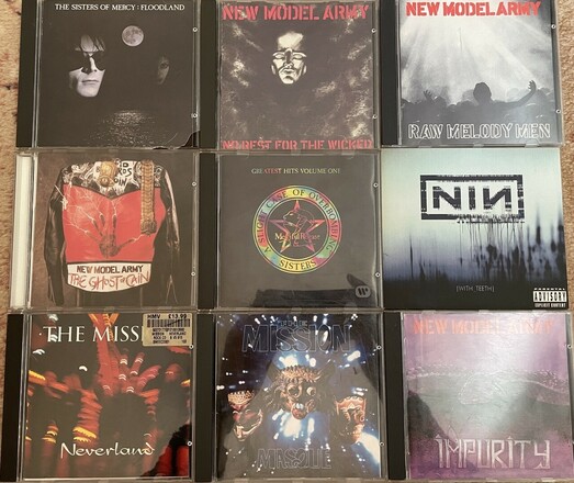 A 3x3 grid of CDs showing albums by The Sisters of Mercy, The Mission, New Model Army & Nine Inch Nails…