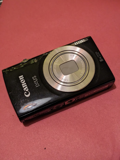 A small Canon Ixus digital camera.