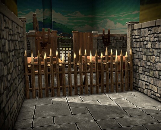 A first person perspective 3D view of a wooden stake barricade, beyond which are two elevated platforms with heavy crossbows pointed at the viewer. Behind them can be seen a distant cavern wall, painted to look like sky, mountains, and clouds.