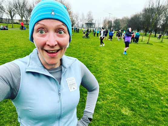 Pale white lady in cold weather running gear after Parkrun 