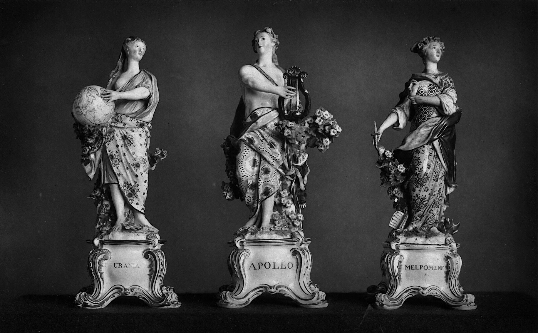 A photomechanical print of the porcelain figures of Apollo and the Muses Urania and Melpomene (~1880).