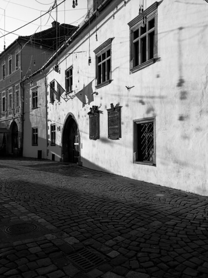 Black and white on a building in the afternoon sun.