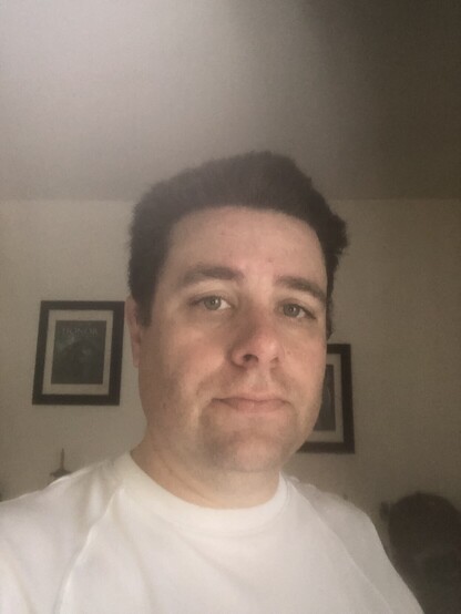 A selfie of a handsome young Frenchman who has just been on a run.