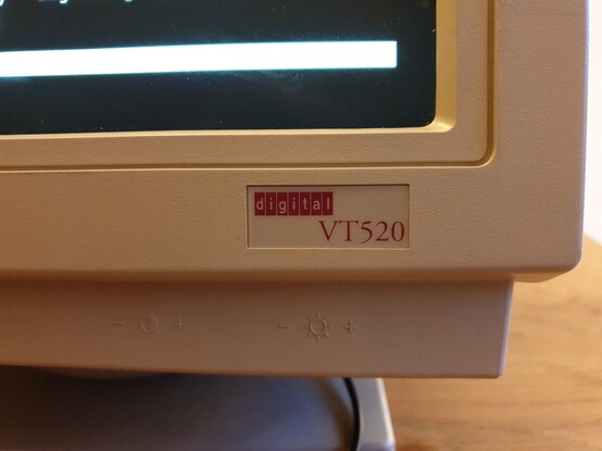 A close-up of the model number badge on the lower-right corner of a VT520 terminal. The badge text is "digital VT520".