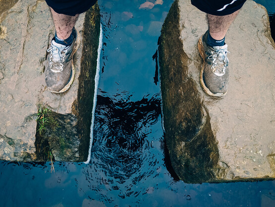 My muddy feet standing on some stepping stones over a stream. You can't tell from the photo, but I'm absolutely furious.