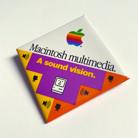 Apple promotional button with the text:

Macintosh multimedia.
A sound vision.