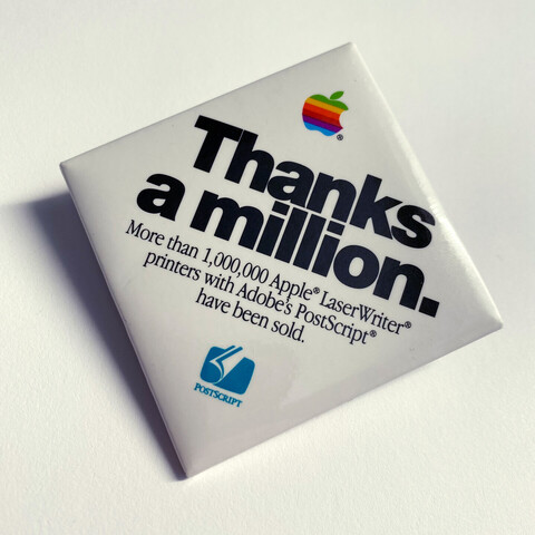 Apple promotional button with the text:

Thanks a million.

More than 1,000,000 Apple LaserWriter printers with Adobe’s PostScript have been sold.