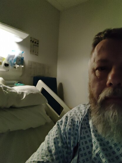 Attractive selfie in an NHS hospital gown