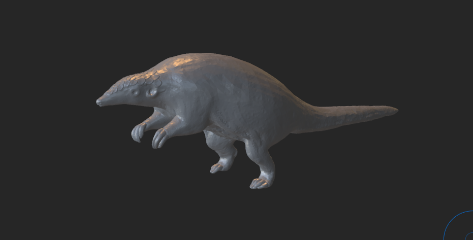 A partially finished sculpt of a pangolin standing on its hind legs. The head and neck have scales sculpted in, but the rest of the body is (relatively) smooth