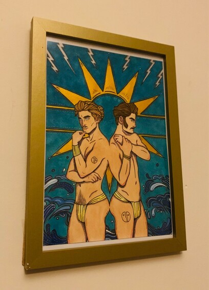 Art depicting two men in thongs joined up back to back. They are on a bright blue background, with a sun emerging from behind them, and waves and lightning bolts.