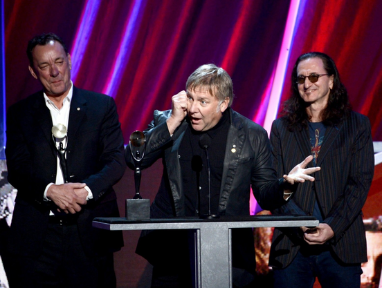 ChatGPT making things up about the article:
In this article, Alex Lifeson talks about his induction ceremony into the Rock and Roll Hall of Fame in 2021. He mentions that Geddy Lee and Neil Peart weren't able to join him in person due to their health issues. He emotionally talks about the excitement he felt receiving the honor in the absence of his two dear friends, with whom he has shared years of music and friendship. He also paid tribute to them in his speech, saying "Geddy and Neil, I wish you were up there with me because you deserve it as much as I do".

