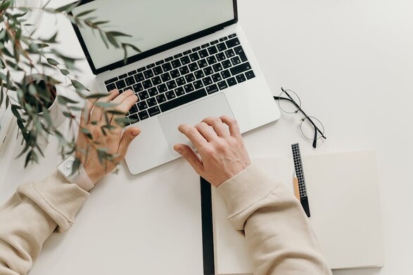 Image of hands typing on the computer