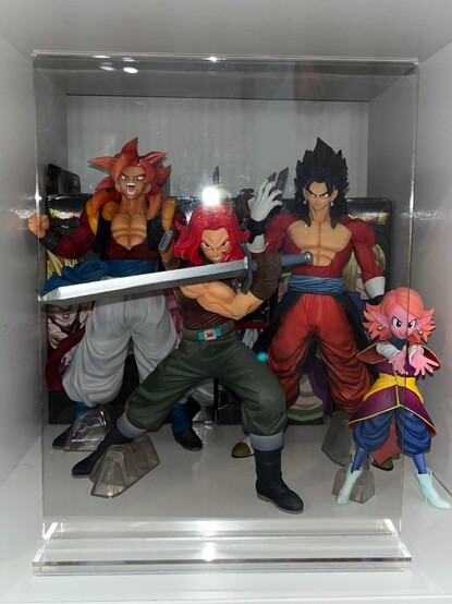 From left to right: Super Saiyan 4 Gogeta, Super Saiyan God Trunks, Super Saiyan 4 Xeno Vegito, Chronoa