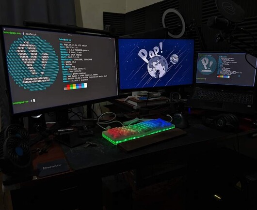 PC and laptop running Pop! OS shown with neofetch