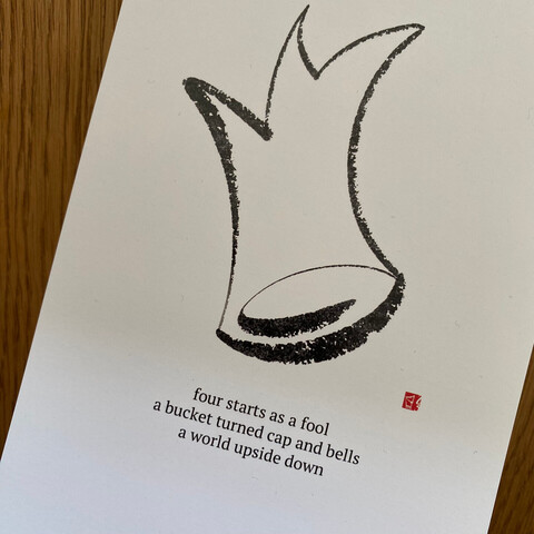 A photo of a calendar page with the haiku from the post.
