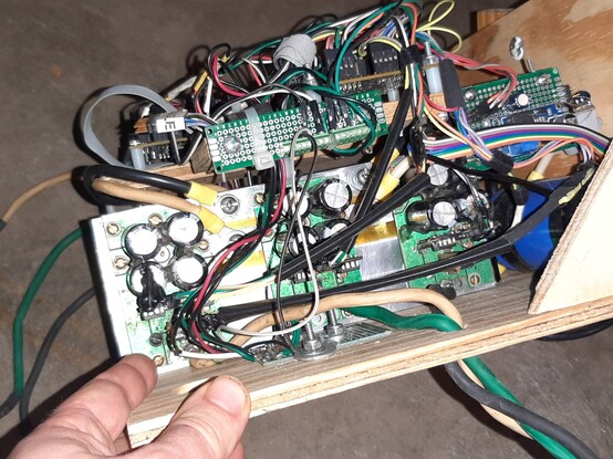 Side view of one motor controller PCB showing three phase legs. Lots of wires flying around. FETs are mounted under PCBs so you can't inspect them without disassembly.