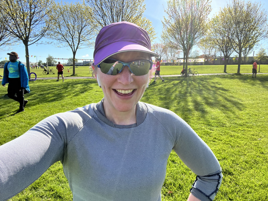 Pale white lady in running gear & sunglasses after Parkrun