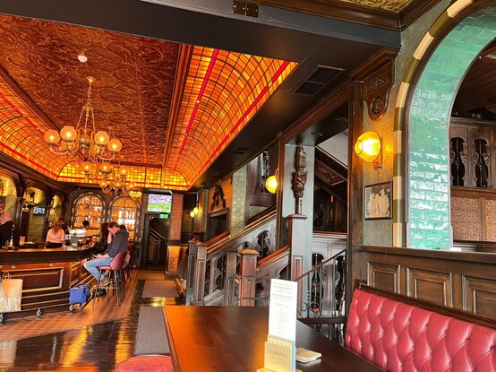 The newly-renovated stained glass ceiling and ground-floor bar at JR Mahons