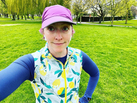 Pale white lady in wet weather running gear before Parkrun