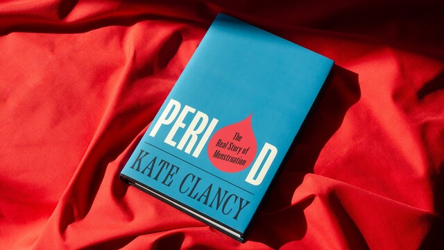 Period by Kate Clancy sits on a red crumpled sheet. The cover is bright blue with the title in white and the "o" replaced by a red droplet. Subtitle is in droplet and author below. 
