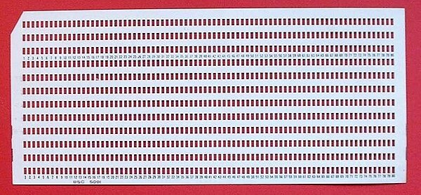 A computer punch card with closely spaced rows of holes punched out, covering nearly the entire surface.