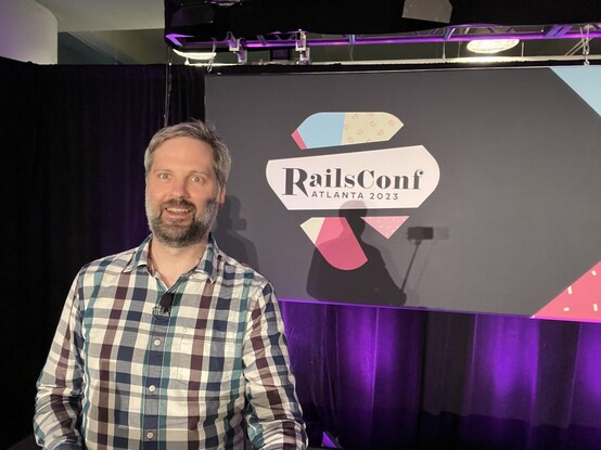 Me in front of the RailsConf logo