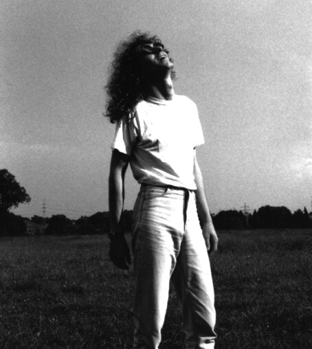 Me in b/w staring back at the sun on a field at a fotoshoot in the 90ties with my band "howmenare"