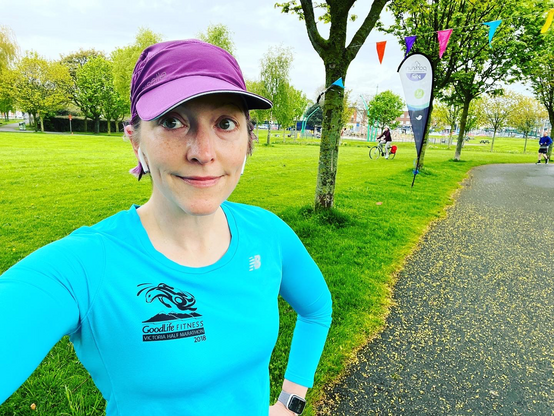 Pale white lady in blue Victoria Half Marathon running shirt before Parkrun