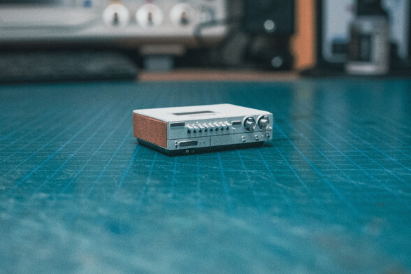 Miniature 1:12 scale VCR, view from the front, on top of a green desk mat