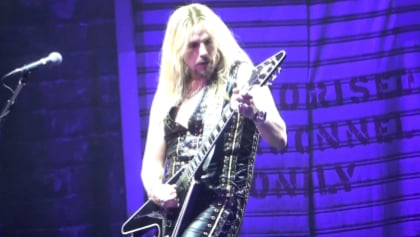 ChatGPT making things up about the article:

Judas Priest guitarist Richie Faulkner has opened up about how his lifestyle has changed following surgeries for a previously undiagnosed heart condition. He said he has had to pay more attention to his diet, exercise, and overall wellbeing, and he now watches how much greens he eats and plans his days around certain exercises. He also said that it has been hard for him to relearn how his body works and be better aware of when he needs to slow down and rest. Despite the challenges, Faulkner remains hopeful and believes the changes he has made will give him more freedom in the long run.

