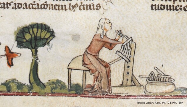 A miniature painted in the lower margin of a medieval manuscript page: folio 138 recto in British Library, Royal manuscript 10 E IV. An expanse of green grass with, at left, a splendidly leafy tree standing tall. To the right of the tree is woman clad in a simple pink gown with a white kerchief covering her hair. She is carding wool. Facing right, she sits atop a 3-legged stool, with a carding paddle projecting out from between her knees, and braced against an erect frame in front of her. She leans forward, reaching out with both hands to draw a second paddle against the first. Her labour will align the fibres of the pale wool, so it can be spun into cloth. The woman gazes right, her expression conveying fierce determination—carding can be tiring work! At far right, a large, round basket rests on the grass. A jumble of carding paddles and other implements peek out the top of it.