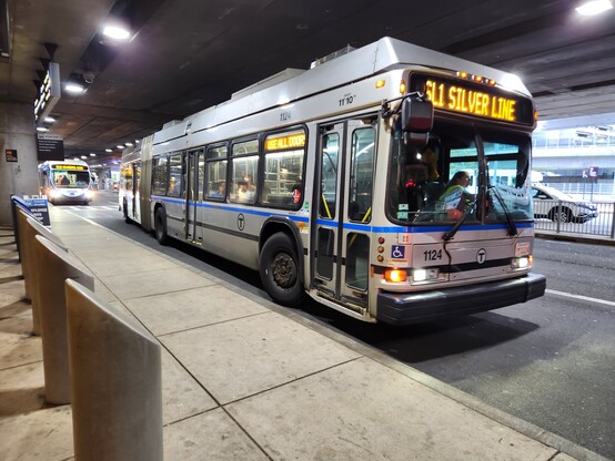 An articulated MBTA Silver Line bus with route sign indicating SL1 SILVER LINE