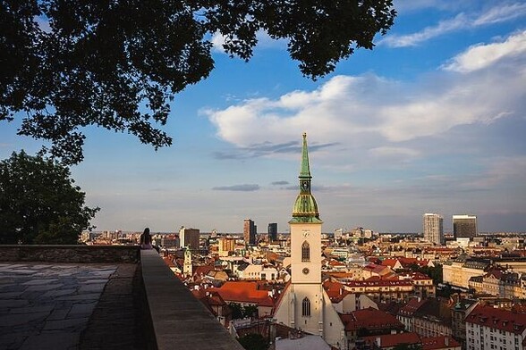 City of Bratislava at sunset in Slovakia. The hill terrace below the Bratislava Castle provides a stunning view over the Old Town with St. Martin's Cathedral as the main landmark in the cityscape.