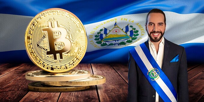 El Salvador's President, Nayib Bukele, smiling next to a Bitcoin physical coin.