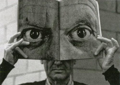 Charles Eames posing with a Mask of Picasso’s Eyes